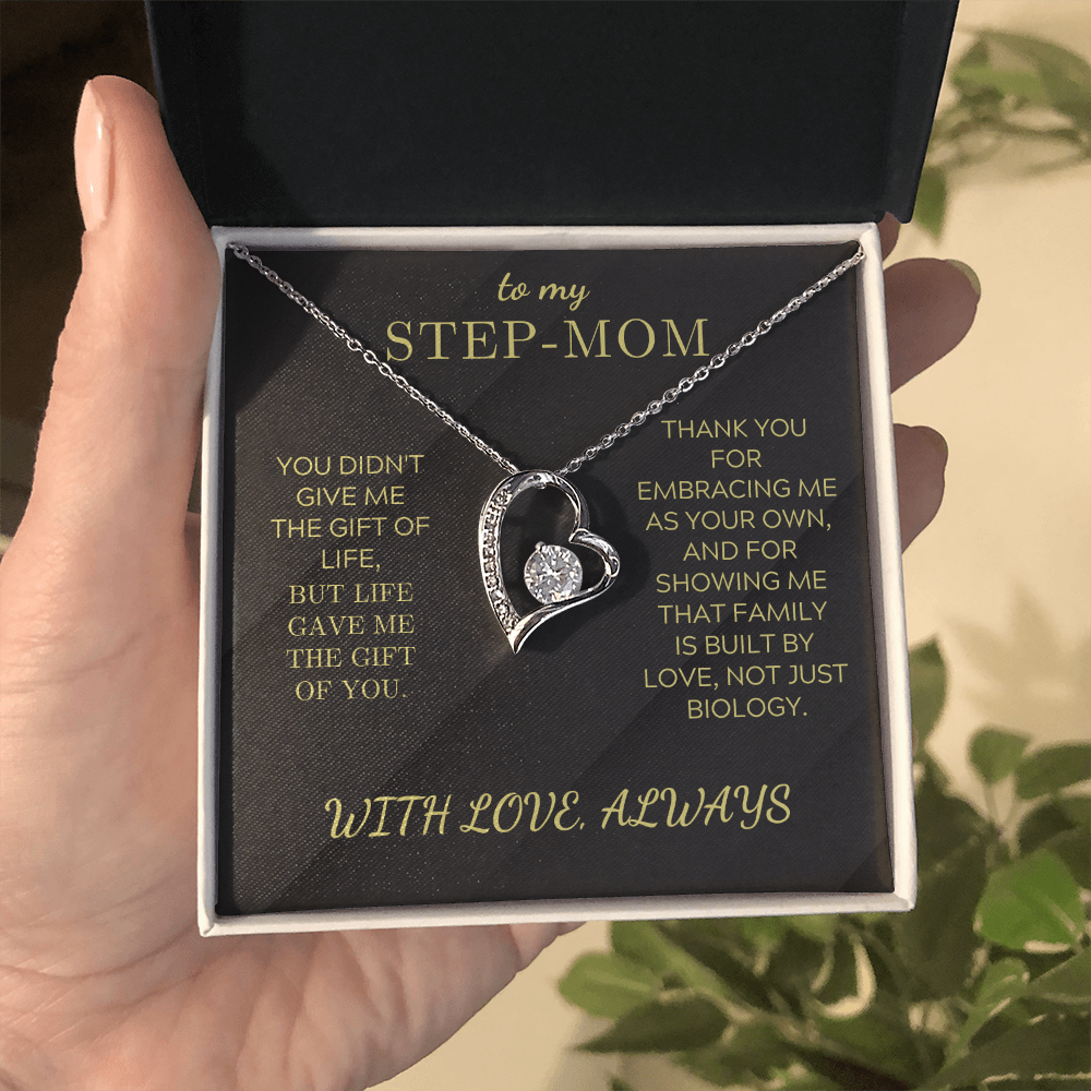 Silver heart pendant necklace in open gift box with chain