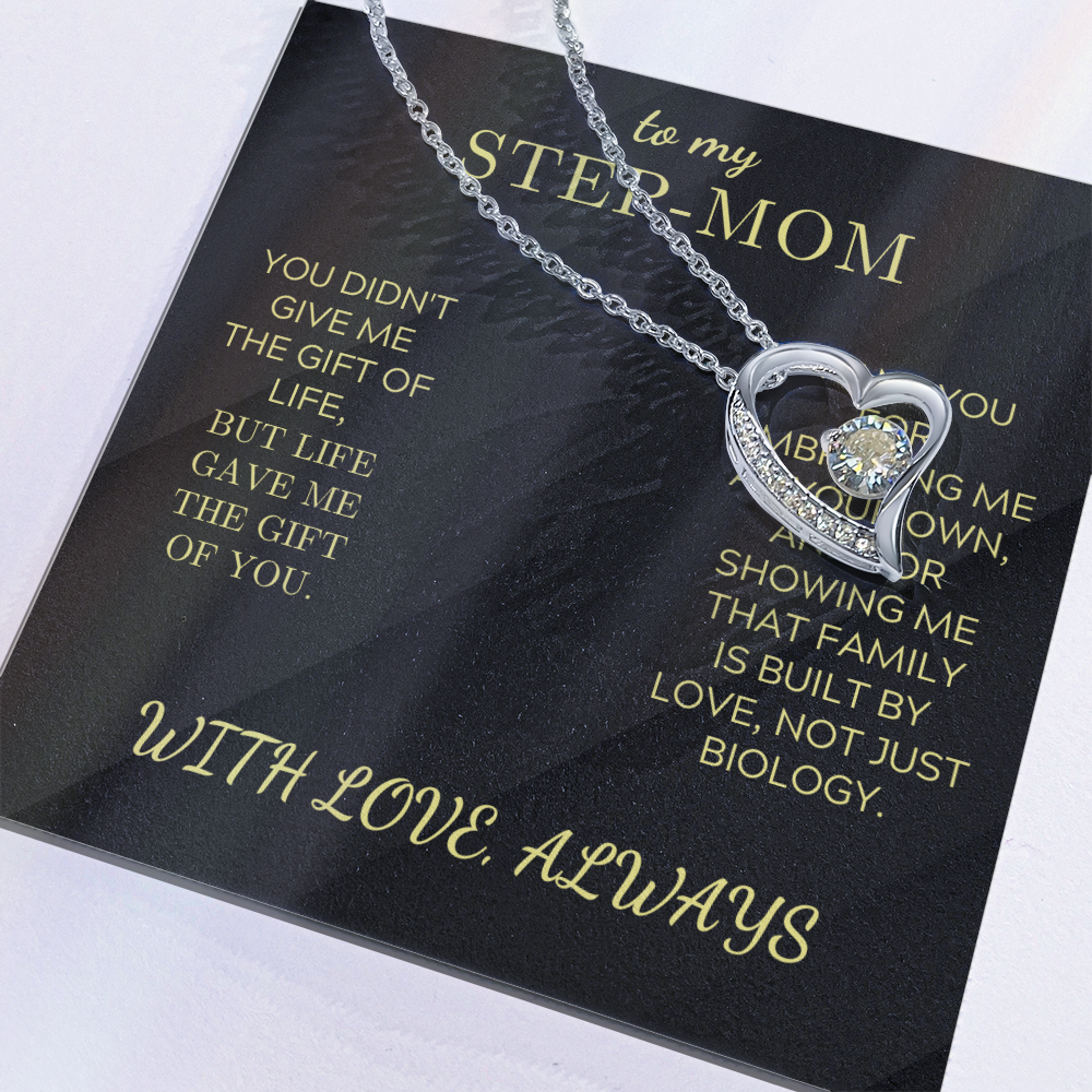 Silver heart pendant necklace on black gift card inside box
