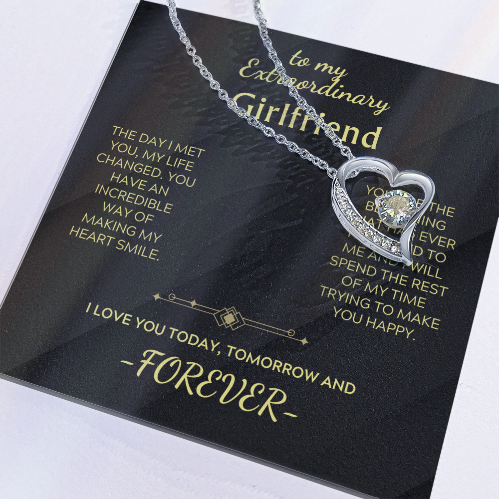 Silver-tone Forever Love Necklace close-up on heart pendant with clear center crystal