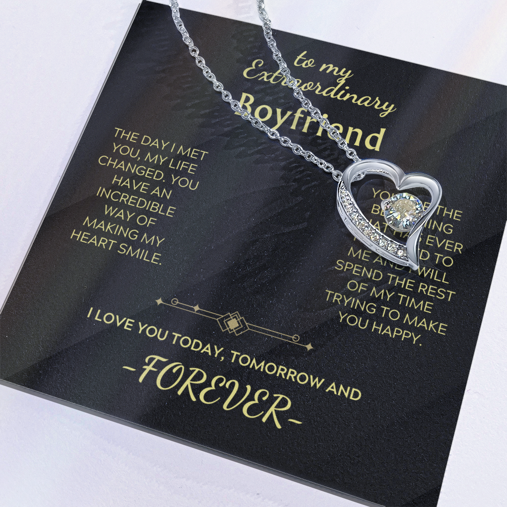Close-up heart pendant necklace with clear stone and silver chain, in gift packaging