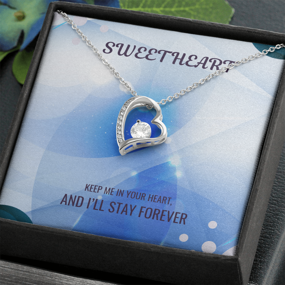 Heart pendant necklace in gift box, silver chain and blue heart with crystal detail