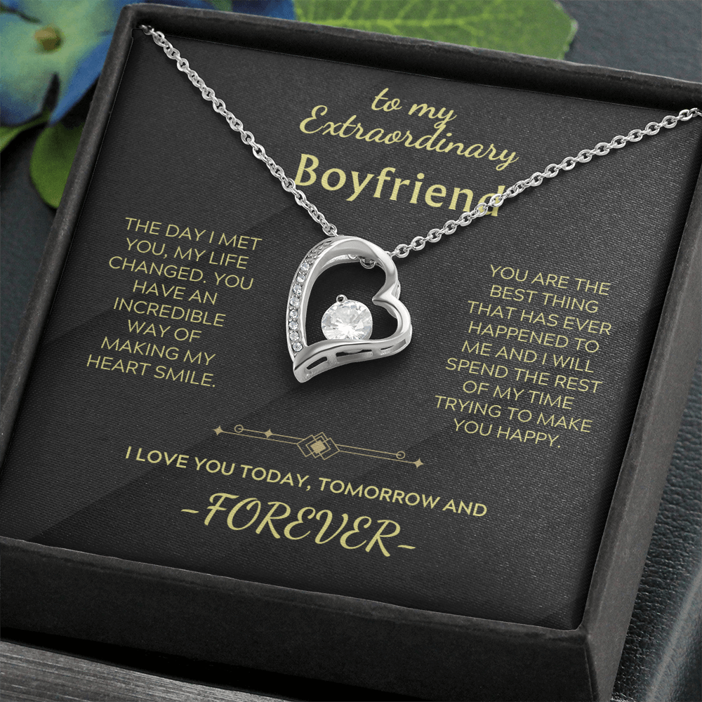 Heart pendant necklace with clear stone on silver chain, black presentation box