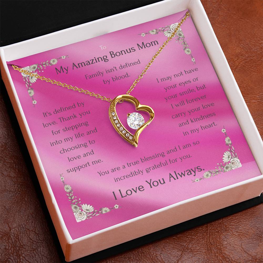 Gold-tone heart pendant necklace with round CZ on pink card in jewelry box