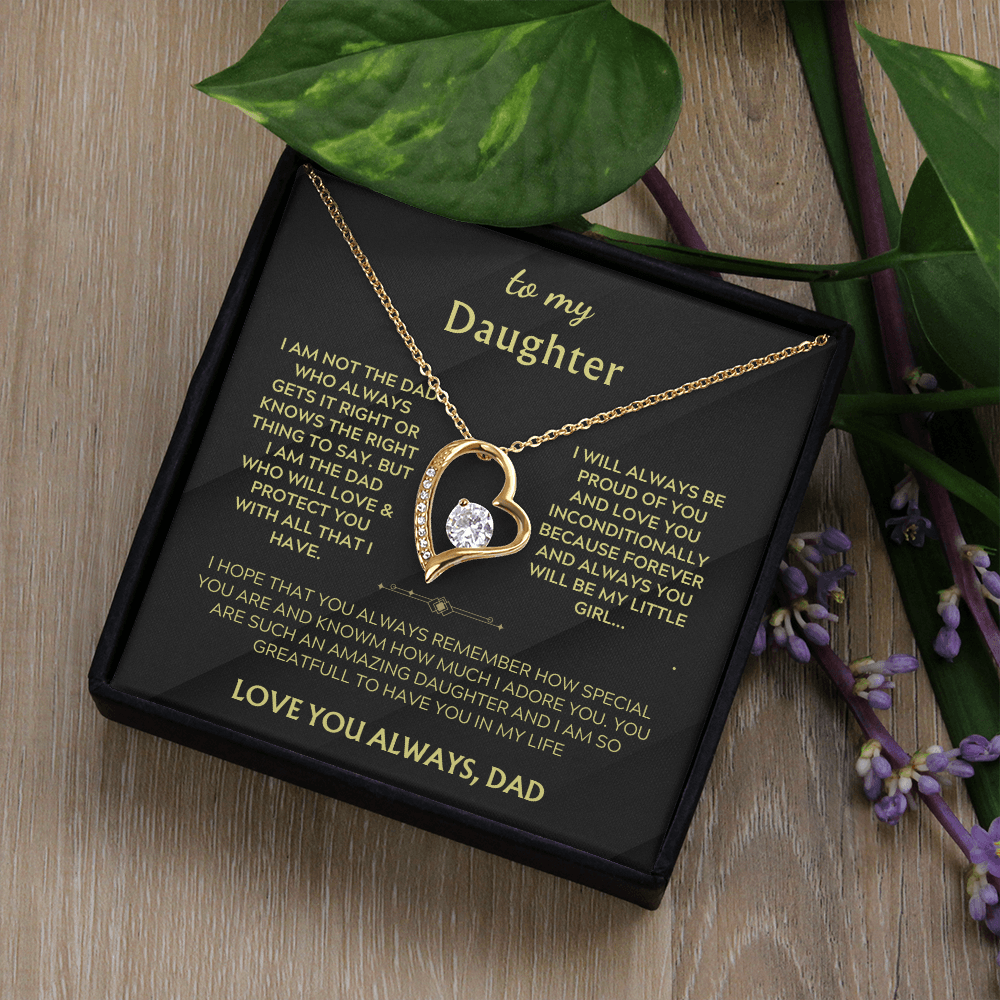 Gold heart pendant necklace with crystal heart on black card in gift box