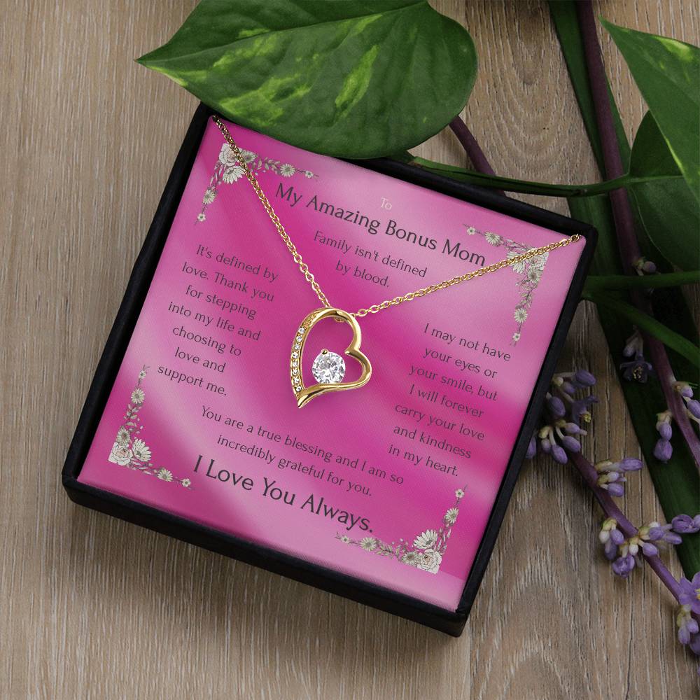 Gold heart pendant necklace with rhinestone border on a pink message card in box