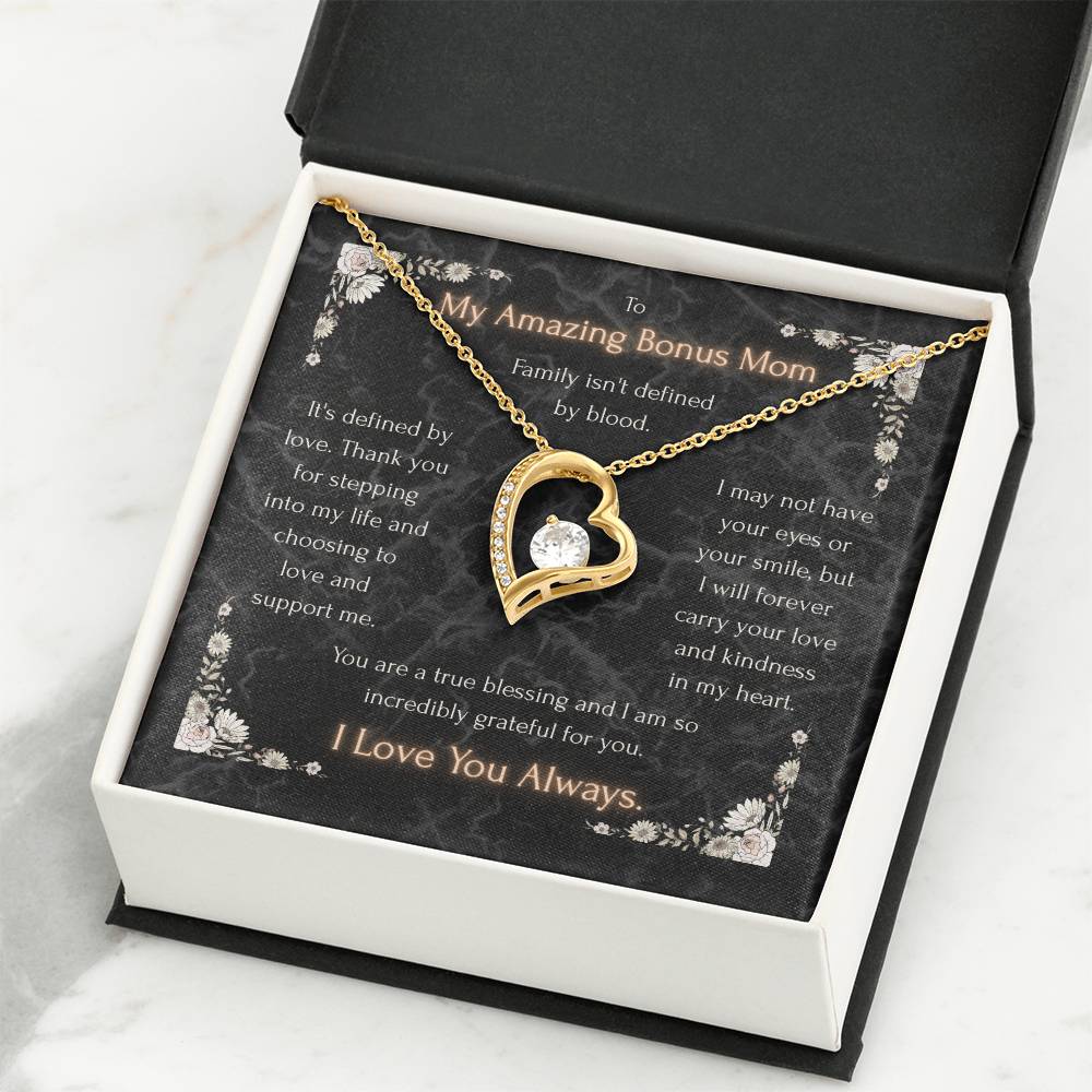 Gold-tone heart pendant necklace in black message card gift box on a white insert