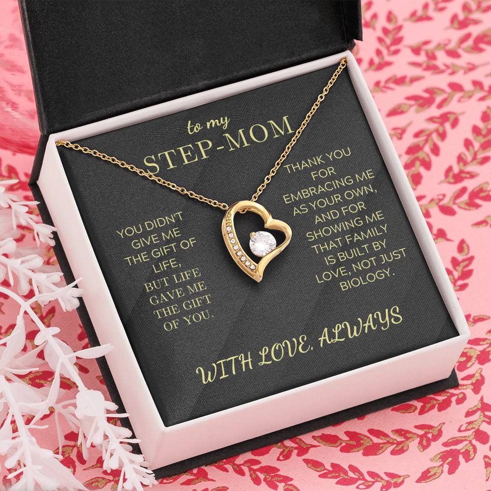 Gold tone heart pendant necklace with round zirconia charm inside black gift box