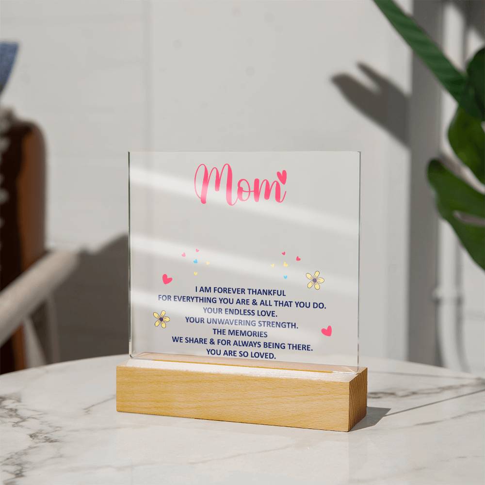 Standing acrylic “Mom” keepsake with message text and wood base