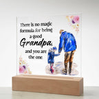 Acrylic square night light with blue grandfather and child figure, floral quote, wood base.