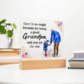 Acrylic square night light with blue grandfather figure and floral quote on wood base.