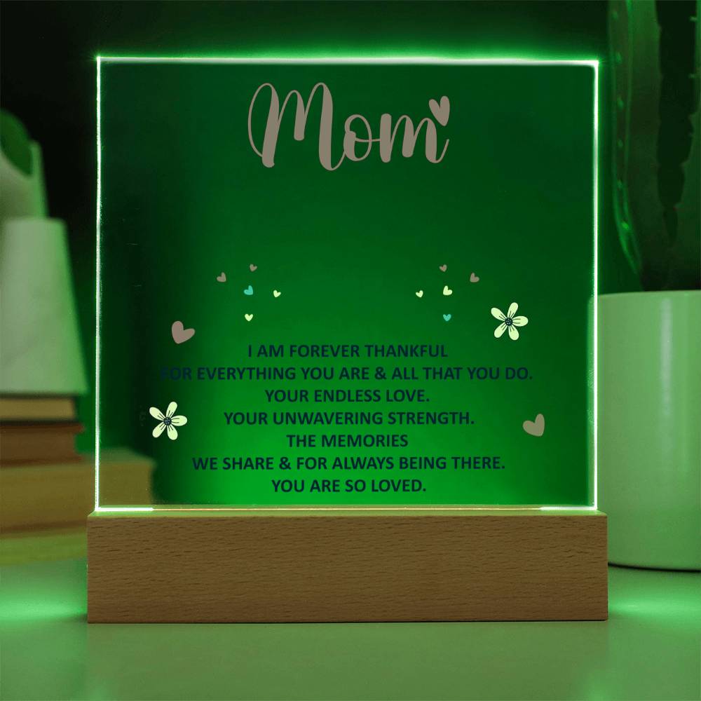 Green-lit acrylic “Mom” keepsake with quote text on wood base