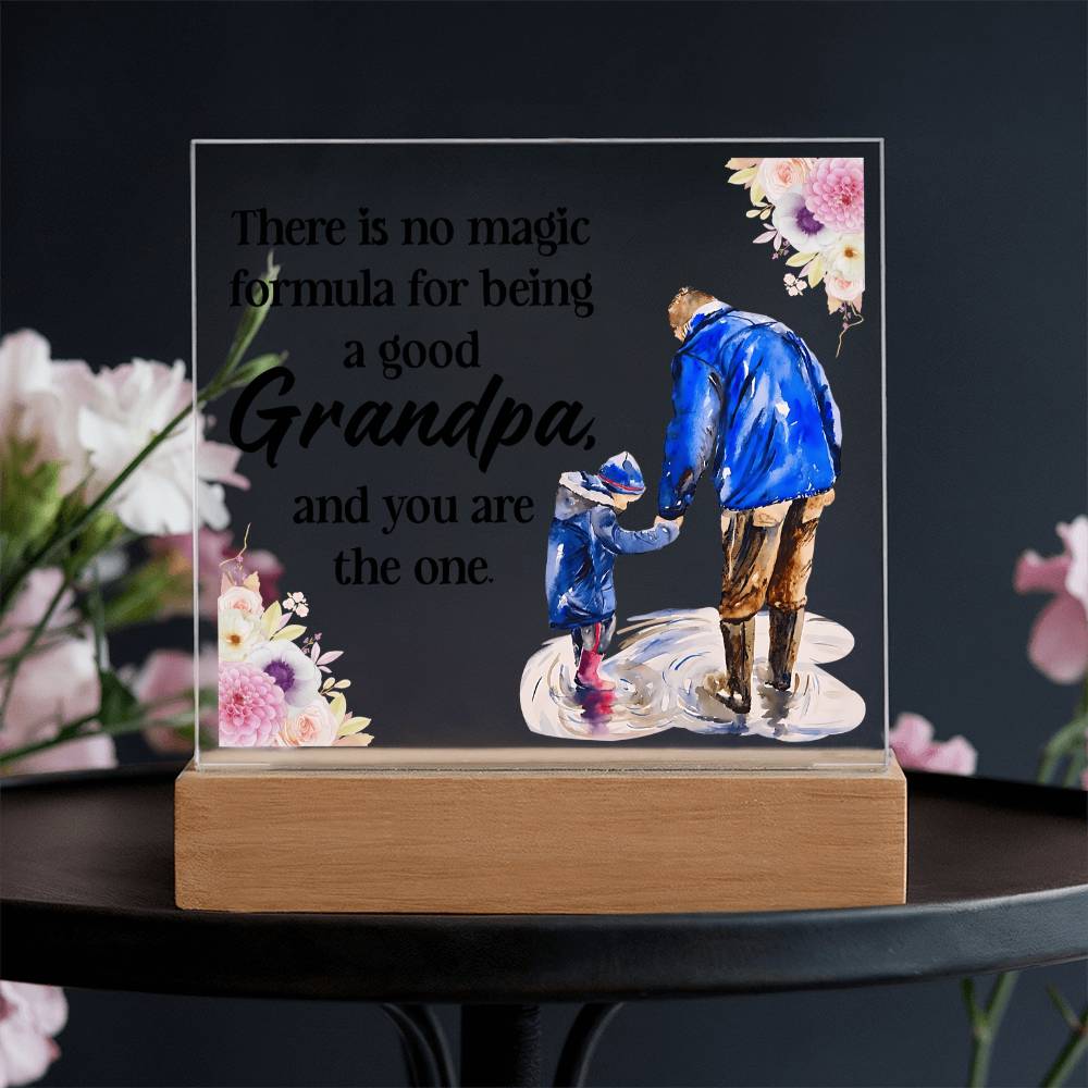 Acrylic square night light with blue grandfather figure and floral quote on wood base.