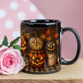 Black glossy ceramic coffee mug with jack-o'-lantern and fall leaf design, side view