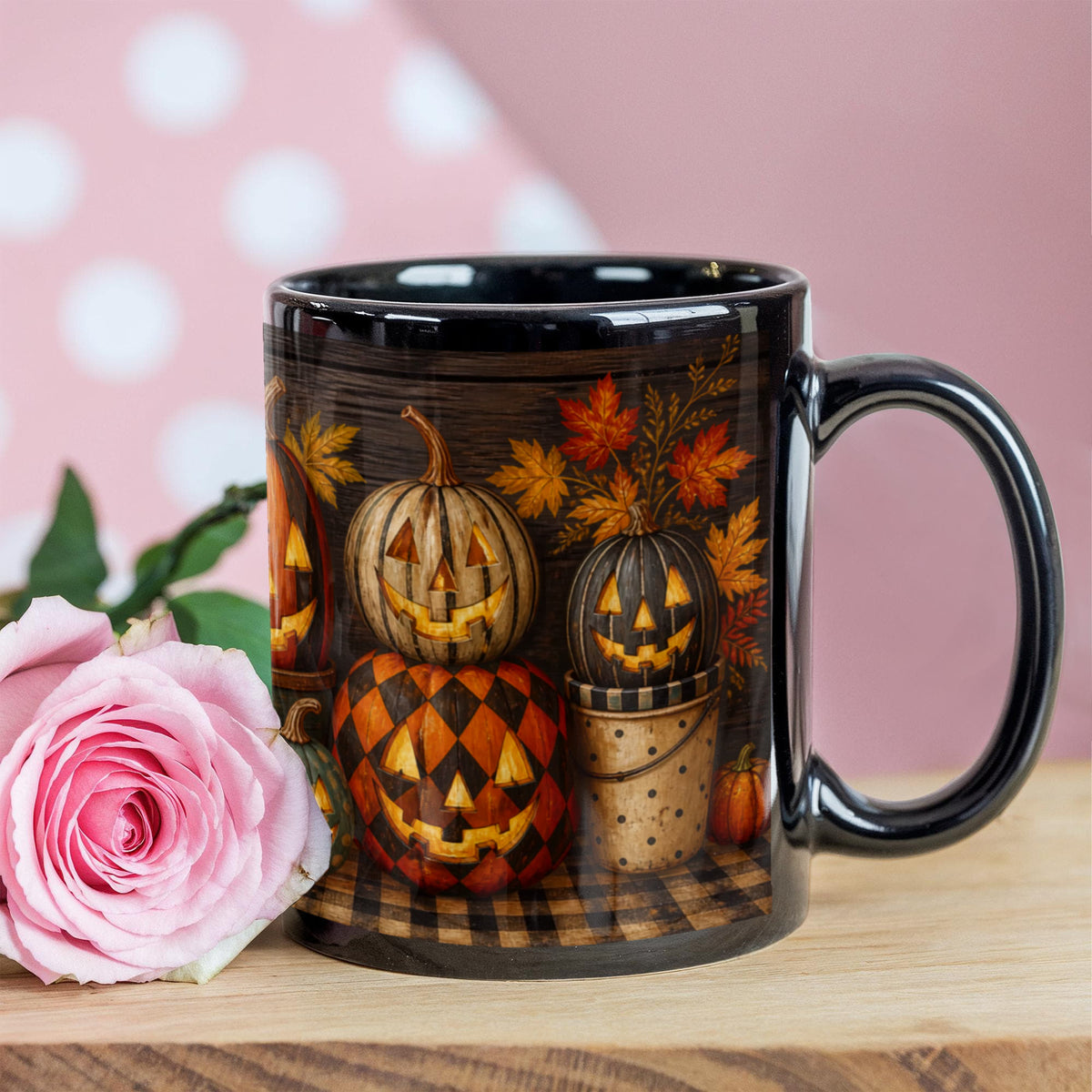 Black ceramic coffee mug with jack-o'-lantern pumpkin scene and handle, on tabletop
