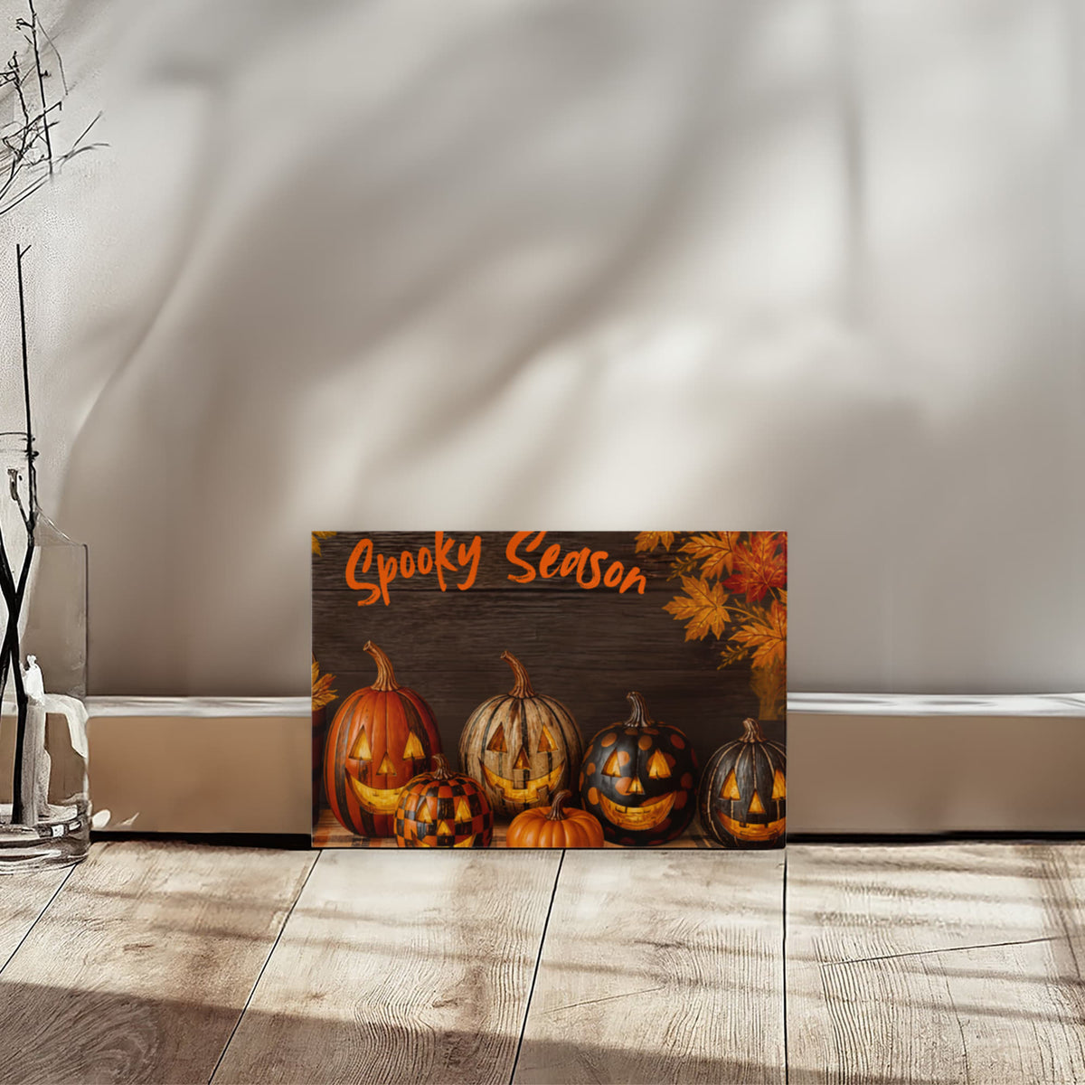 Small Halloween canvas print on floor with pumpkins and “Spooky Season” orange title