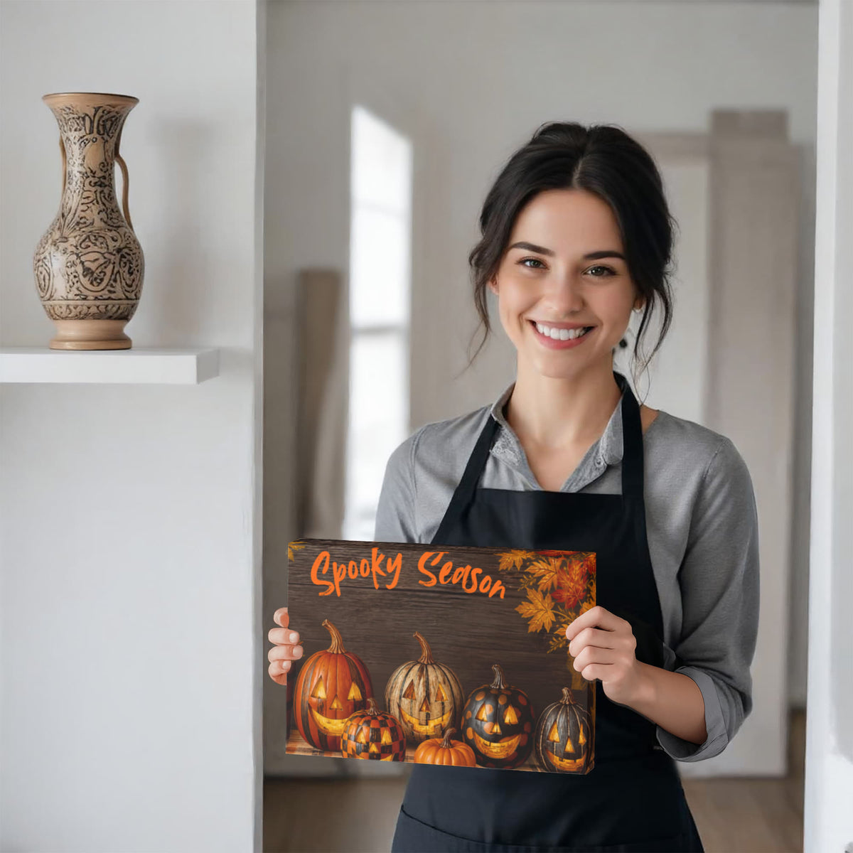 Halloween canvas print showing orange pumpkins, jack-o'-lantern faces, and “Spooky Season” text.