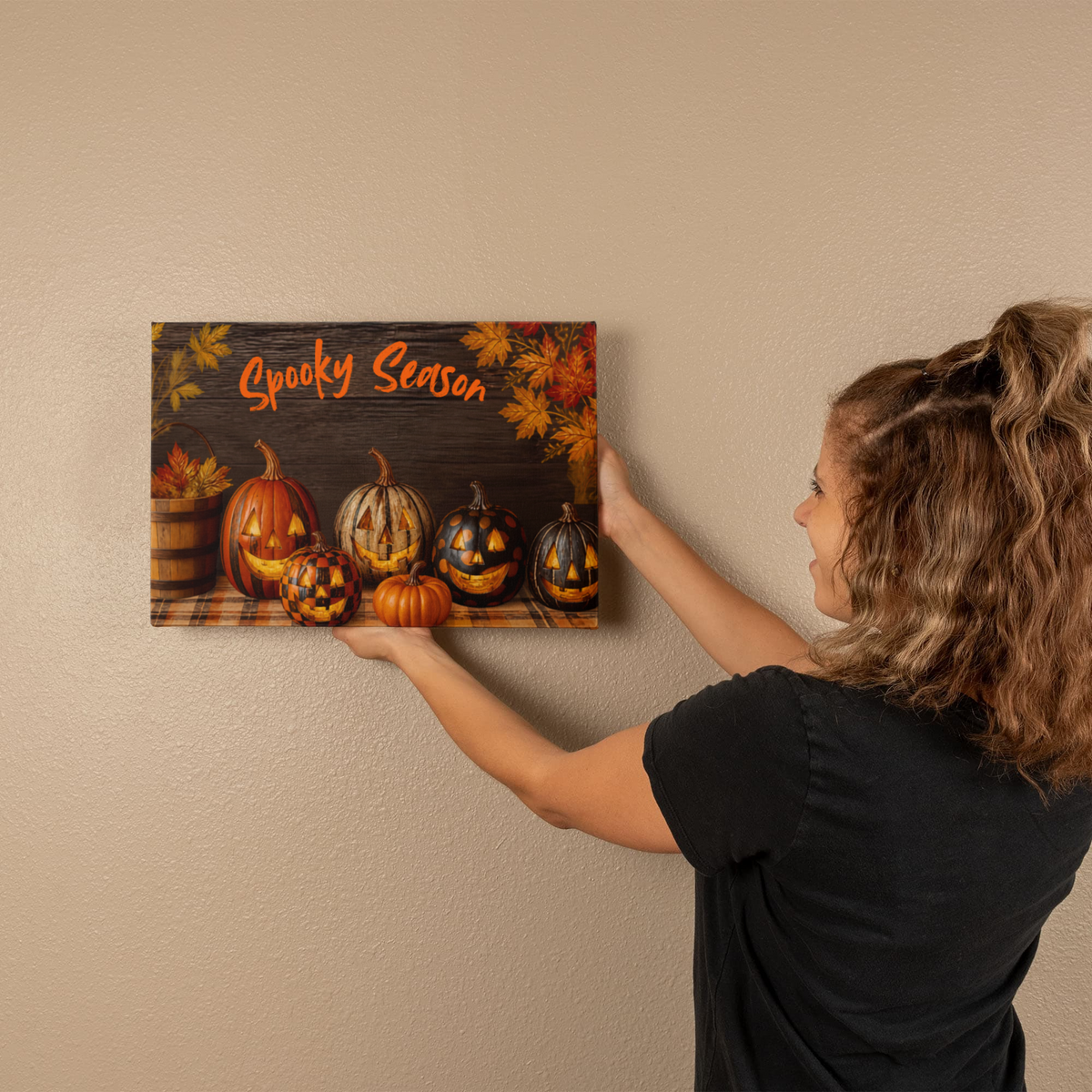 Wall-hung Halloween pumpkin canvas print with orange “Spooky Season” lettering