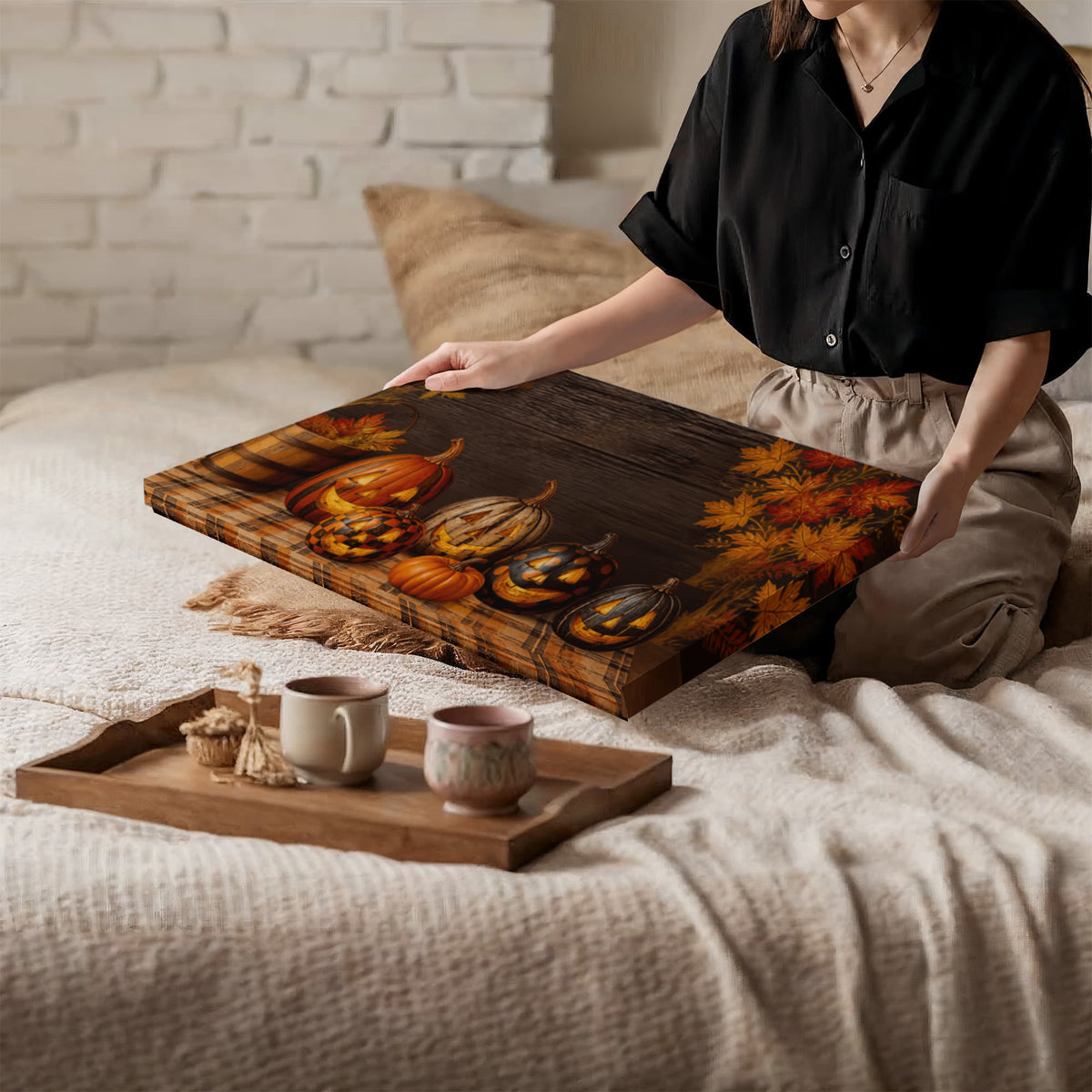 Pumpkin themed canvas print with jack-o-lanterns and autumn leaves on dark wood
