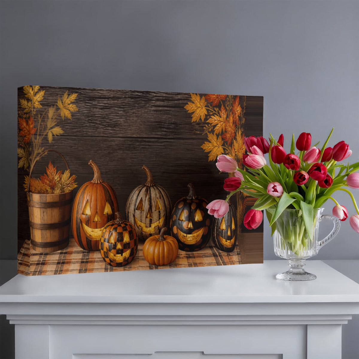 Autumn pumpkin canvas print with jack-o’-lanterns beside a vase of pink tulips