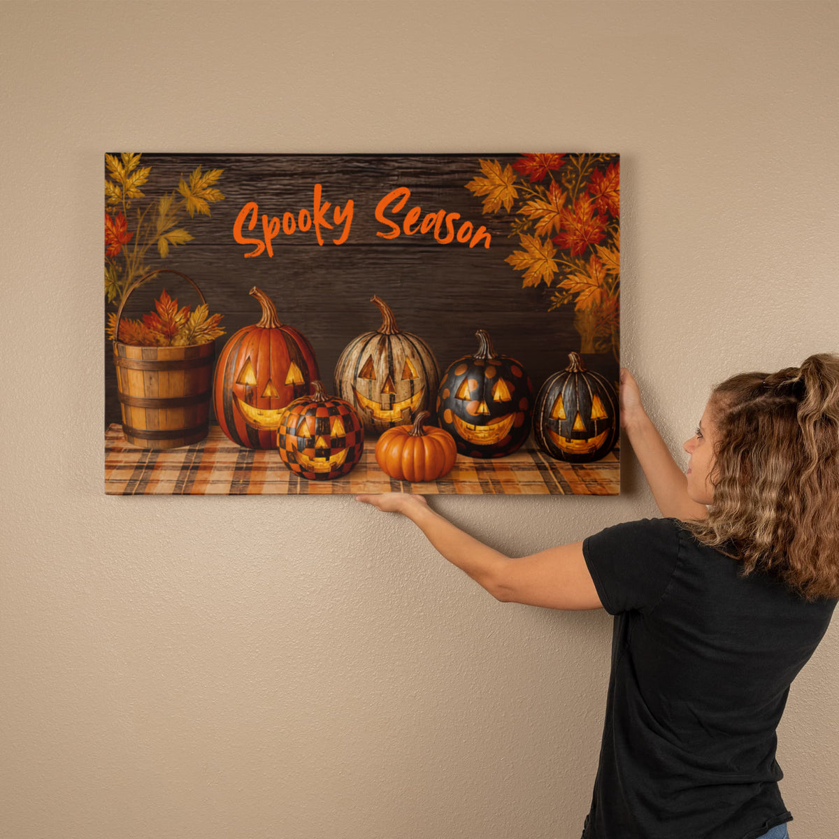 Spooky Season Halloween canvas print with multiple jack-o'-lantern pumpkins and autumn leaf accents.