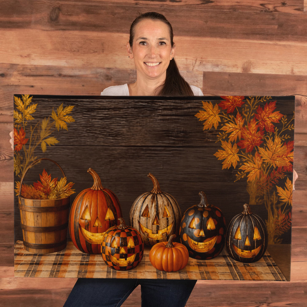 Pumpkin canvas print with jack-o-lantern pumpkins on plaid and dark wood background