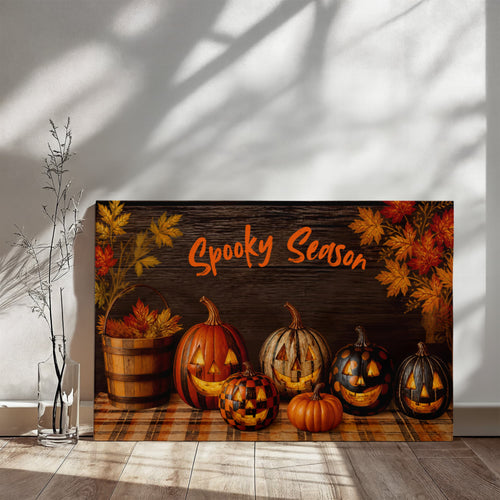 Halloween canvas print with “Spooky Season” headline and jack-o'-lantern pumpkins on a dark wood scene.