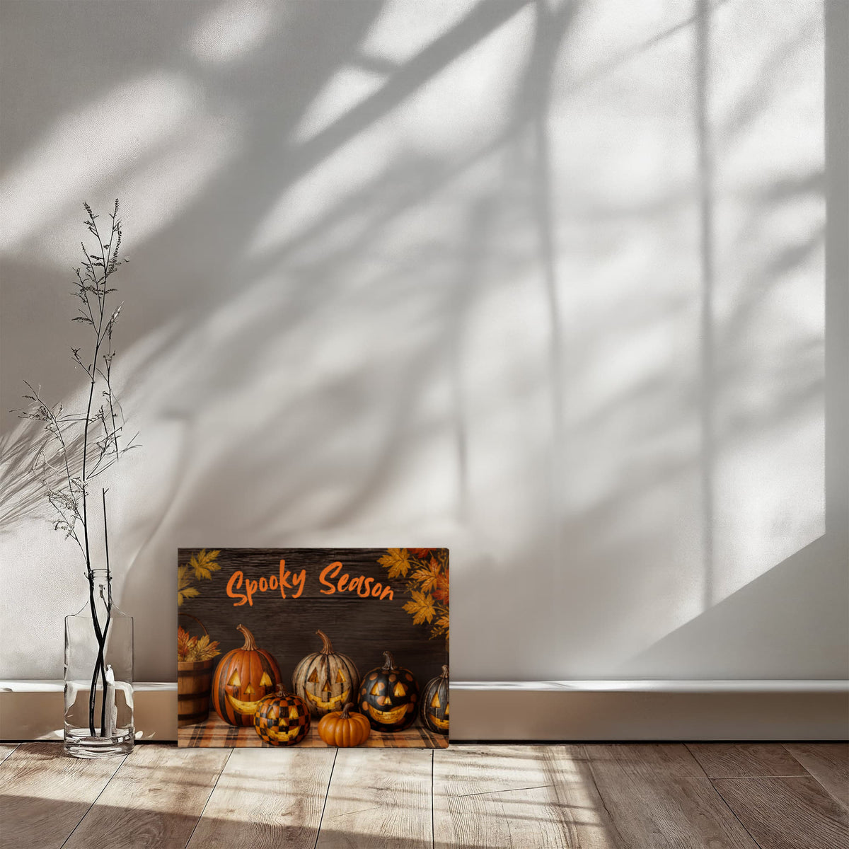 Halloween pumpkin canvas print on the floor with orange “Spooky Season” title