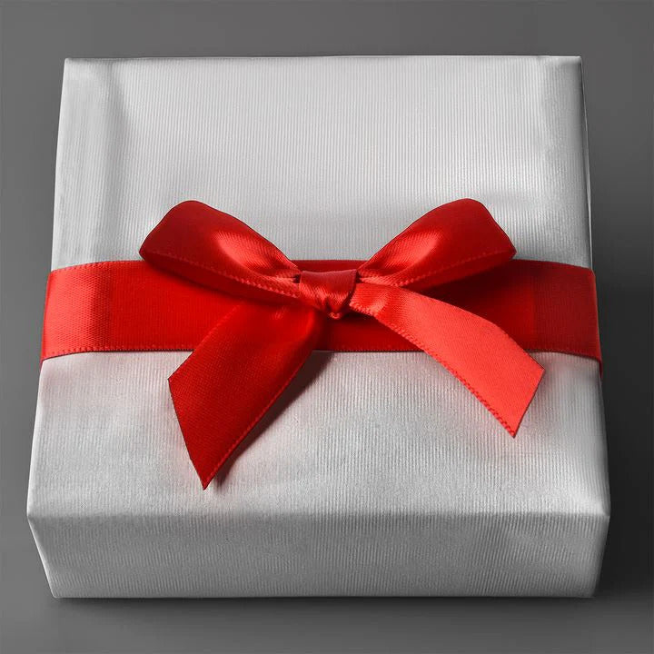 White gift box with red satin ribbon bow